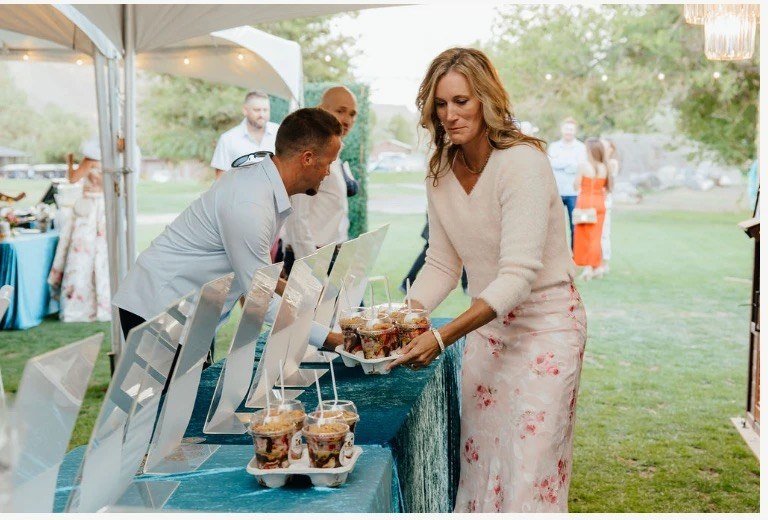 Niki setting out treats at the event